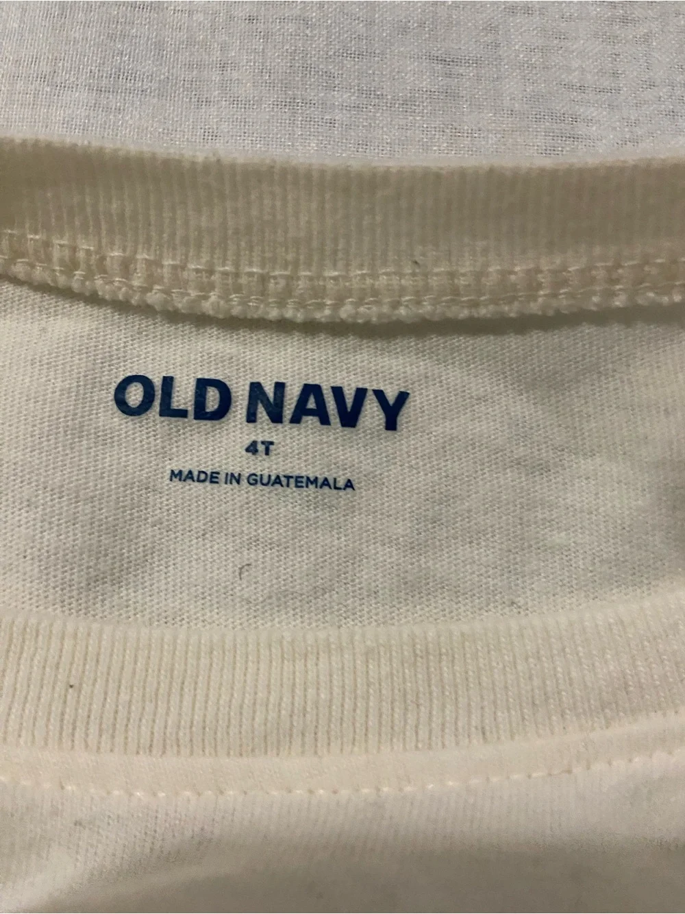 Old Navy Cream Tee with Blue Dinosaur and Orange Backpack